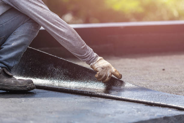 Professional Exterior Waterproofing technician working in Brunswick, NC